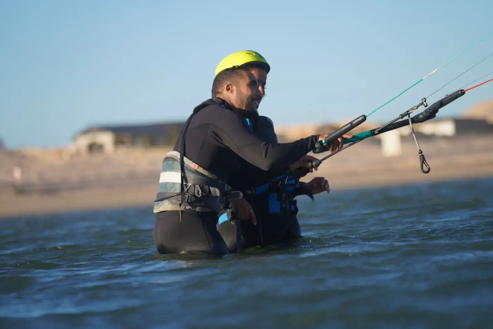 Kitesurfing instructor explaining techniques on the beach in Morocco